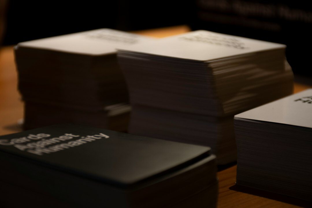 Stack of printed public records and government contracts on a desk