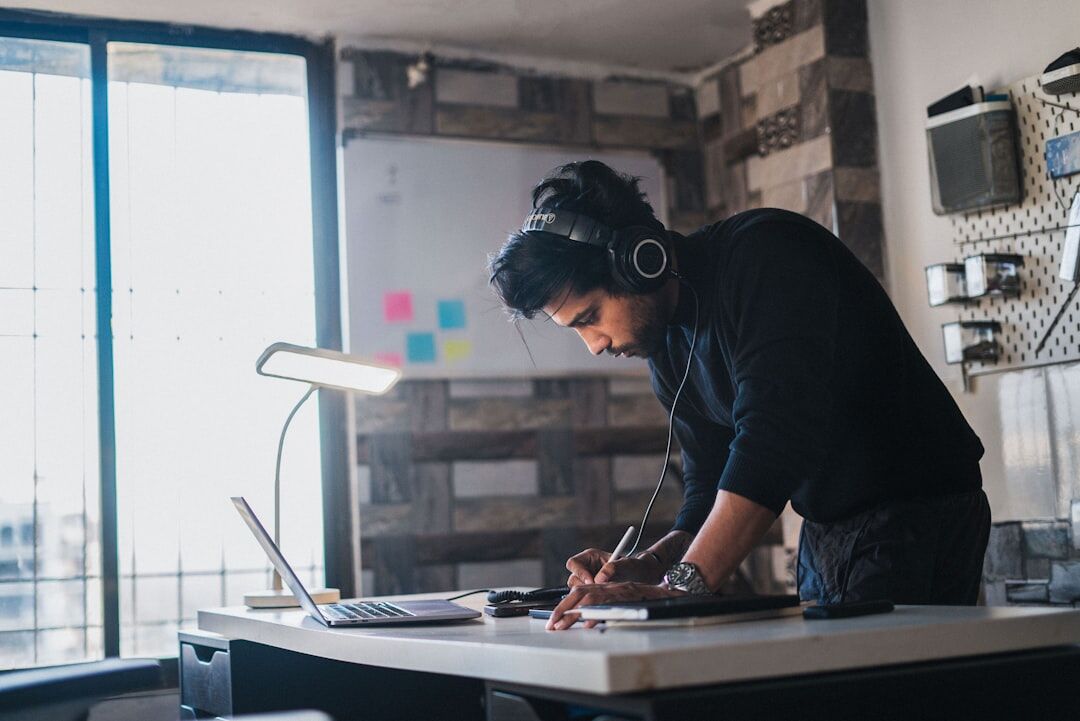 person reviewing documents at desk